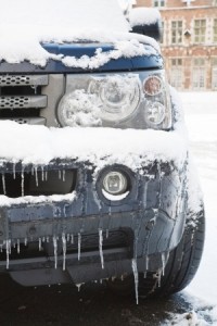 Closeup of a land rover covered in snow and ice. Ideal to depict dangerous driving conditions