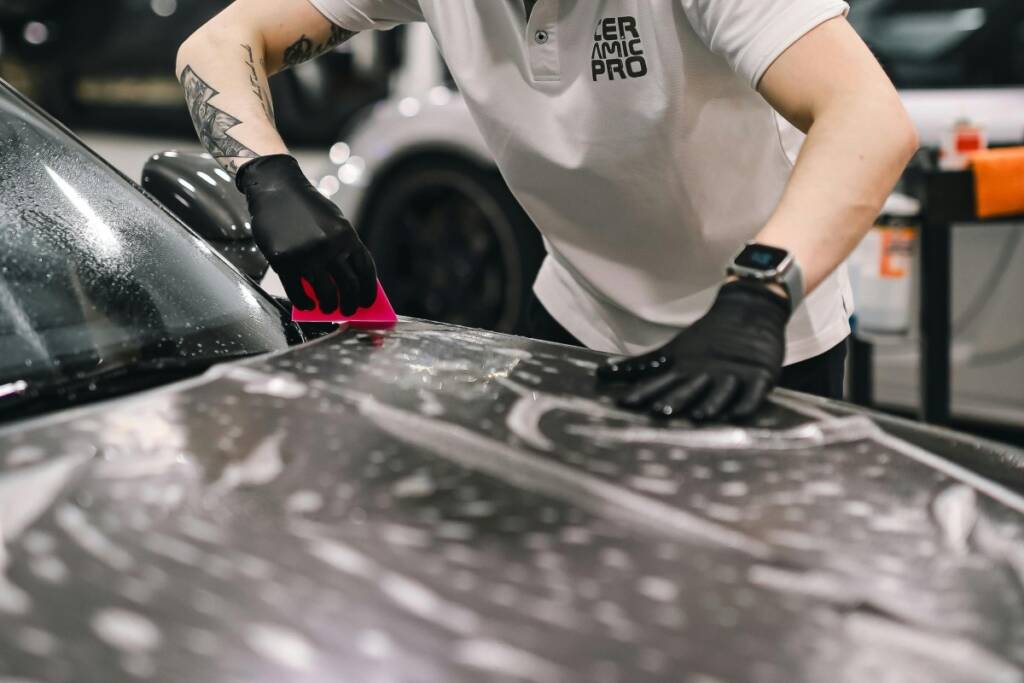 Technician applying a paint protection film 
